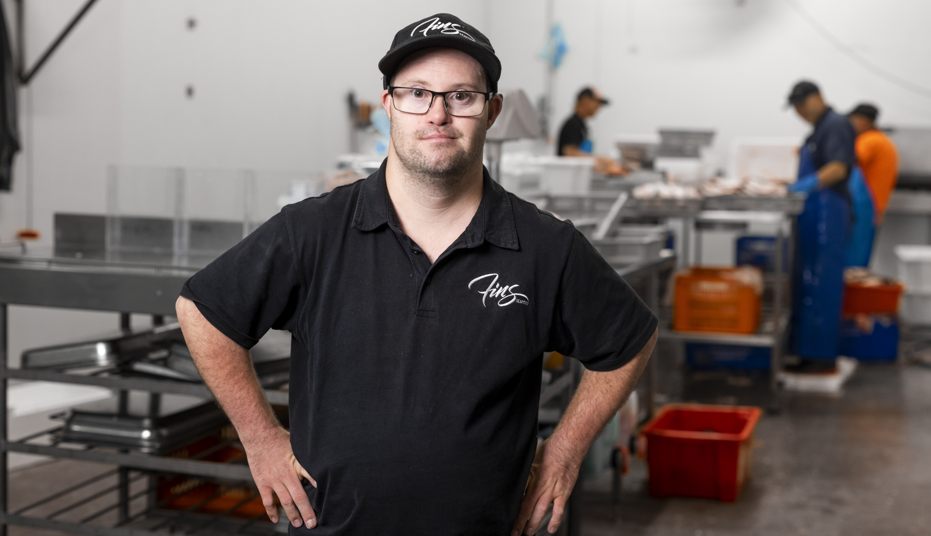 man with his hands on his hips in a fisheries