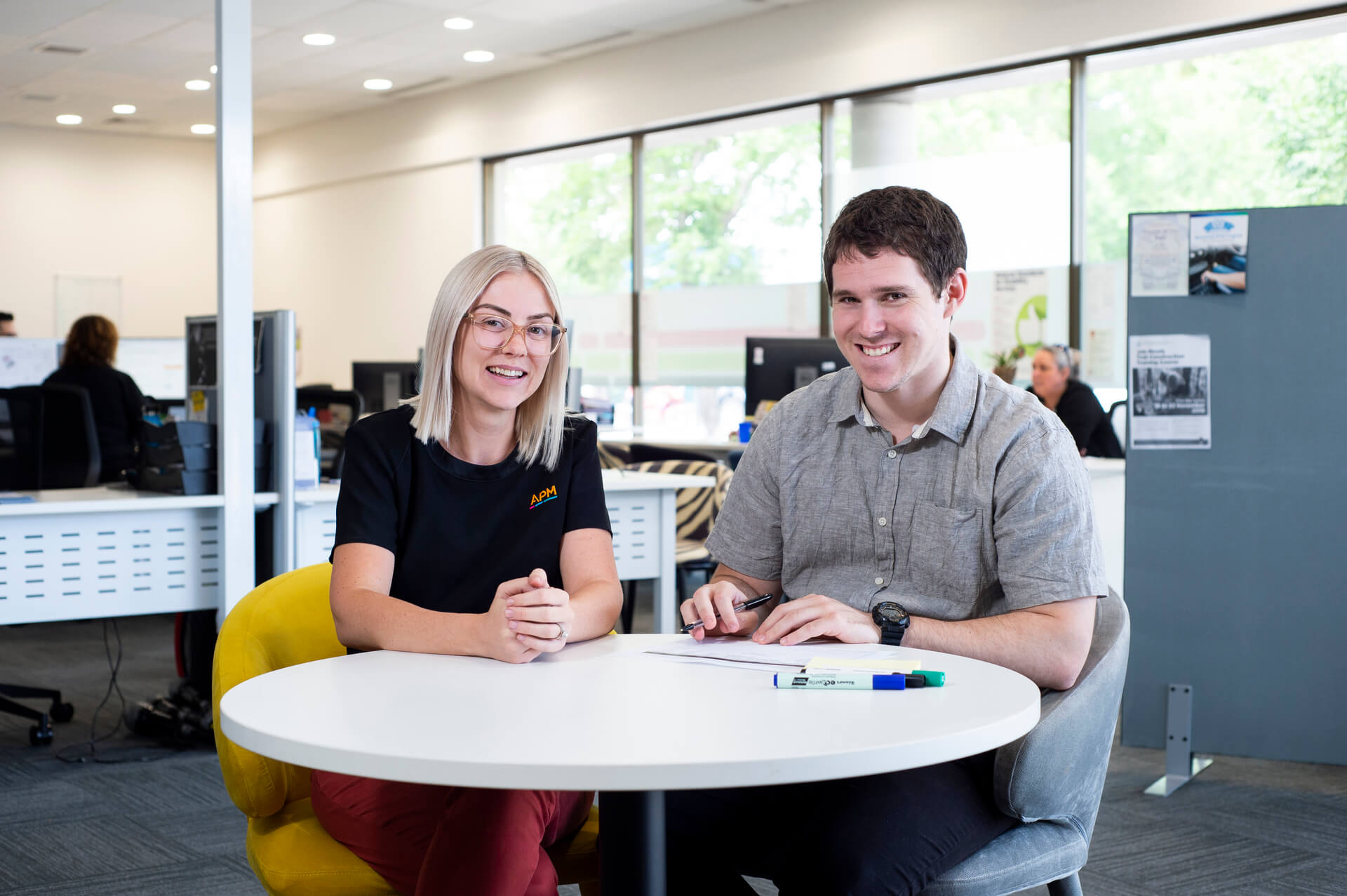 two people discussing at APM offices