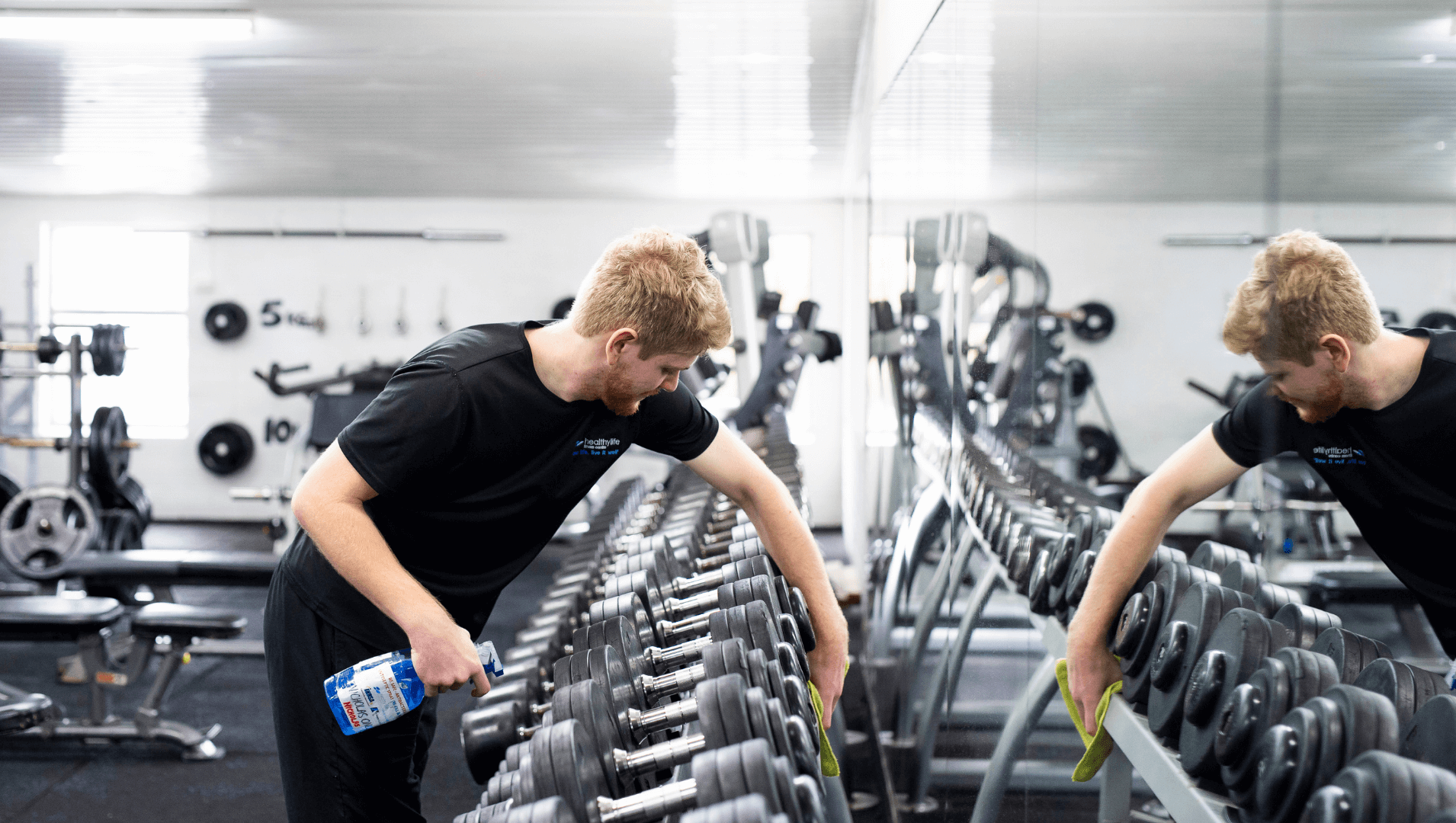 Nicholas cleaning gym equipment