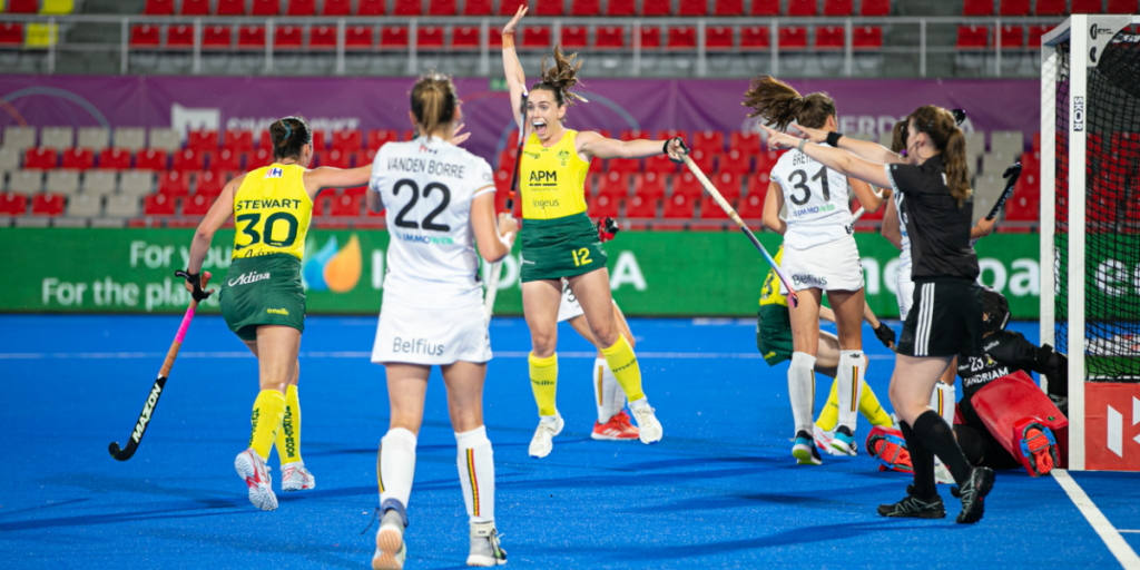 APM sponsored Hockeyroos cheering a goal during a match