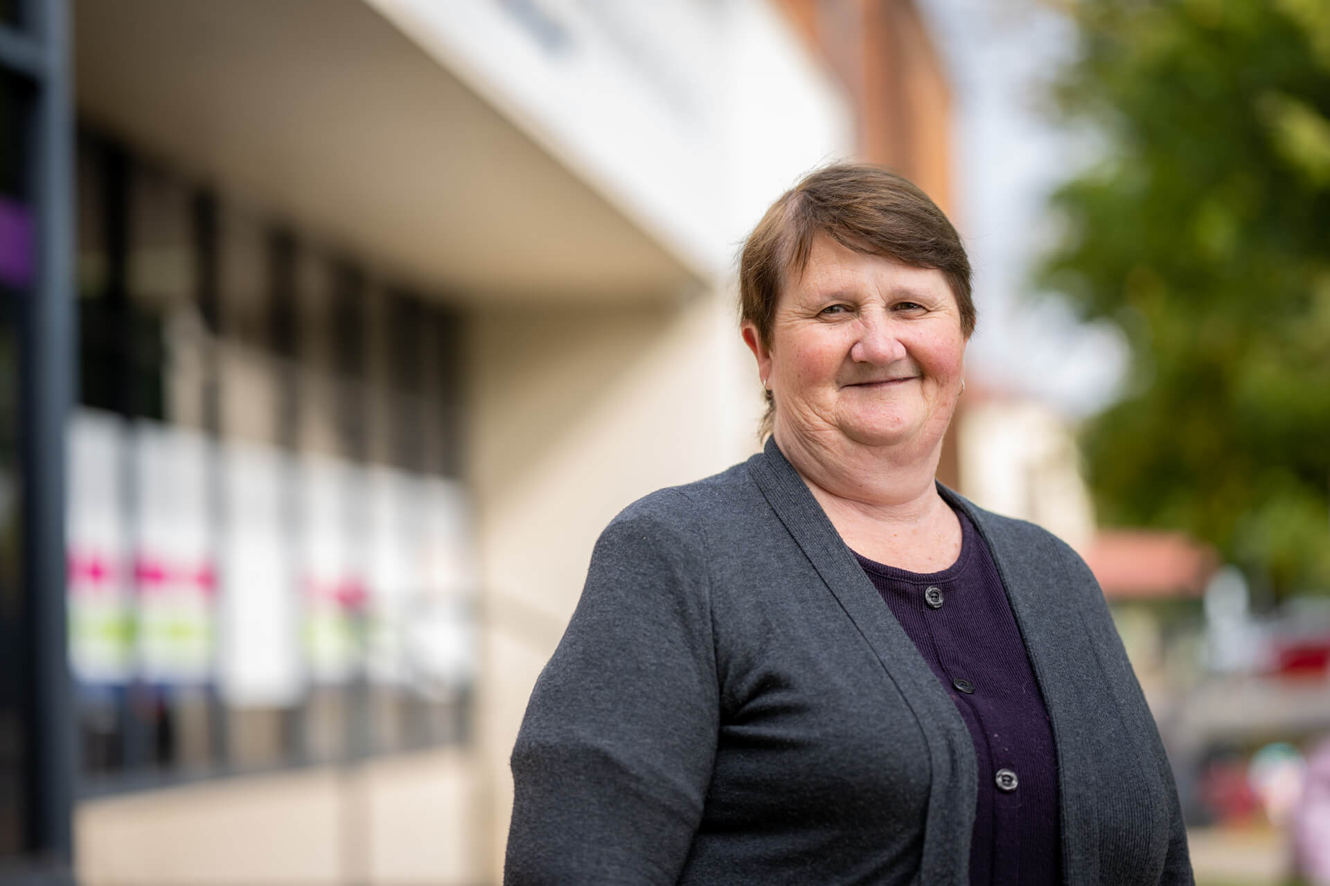 Ruth smiling outside an APM office