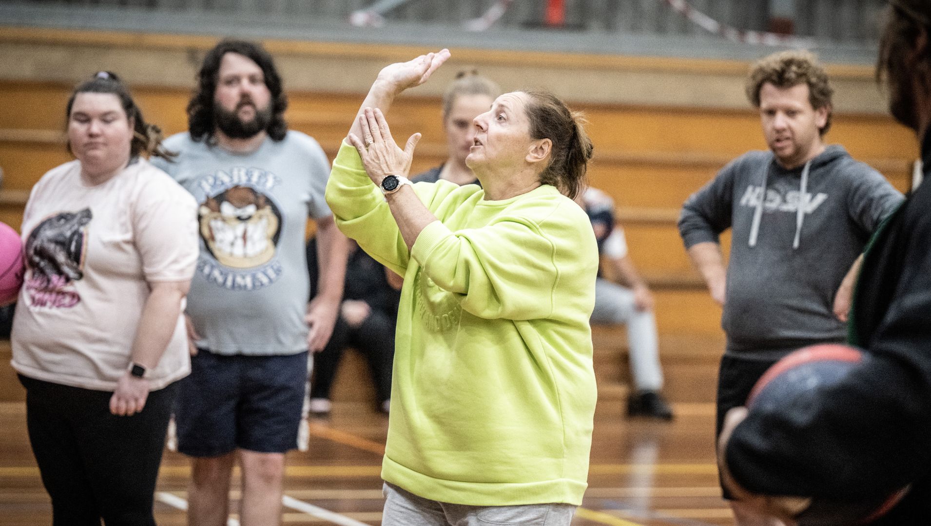 Basketball coach teaches how to shoot to APM sponsored all ability club