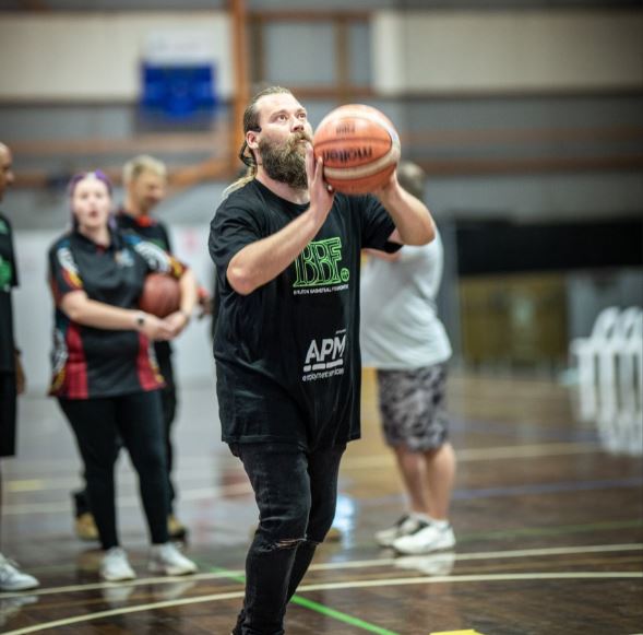 Man shoots with a basketball