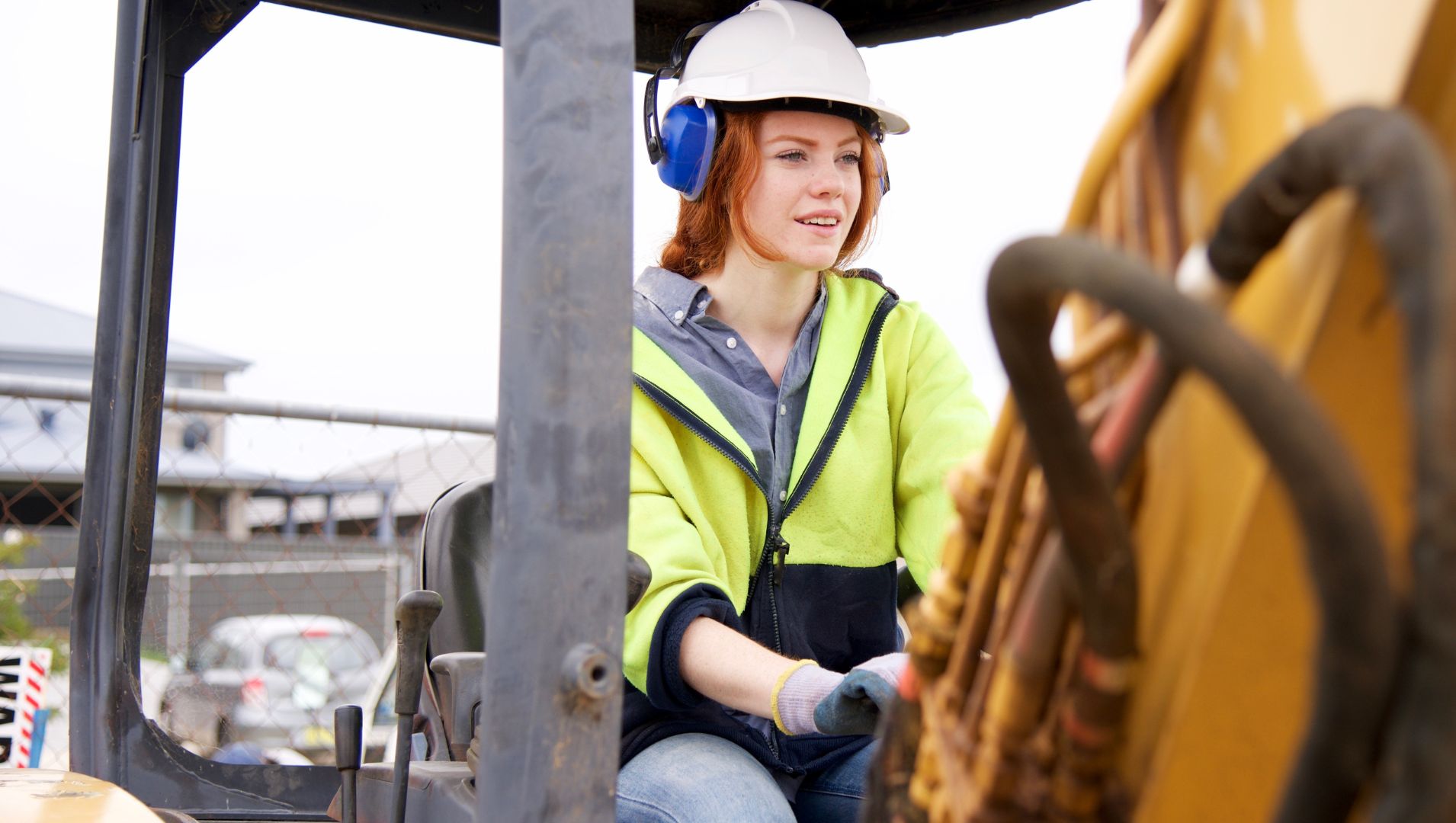 Young woman apprentice on a digger 