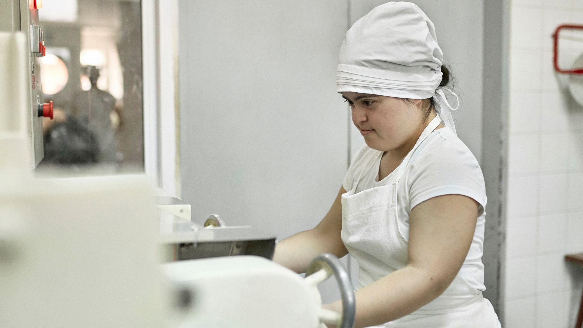 Workplace skill assessment in a commercial kitchen environment, evaluating job performance and safety compliance.