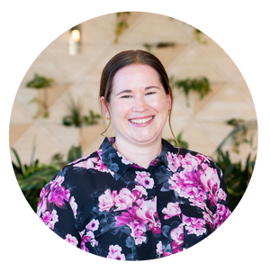 Woman in floral business shirt smiling