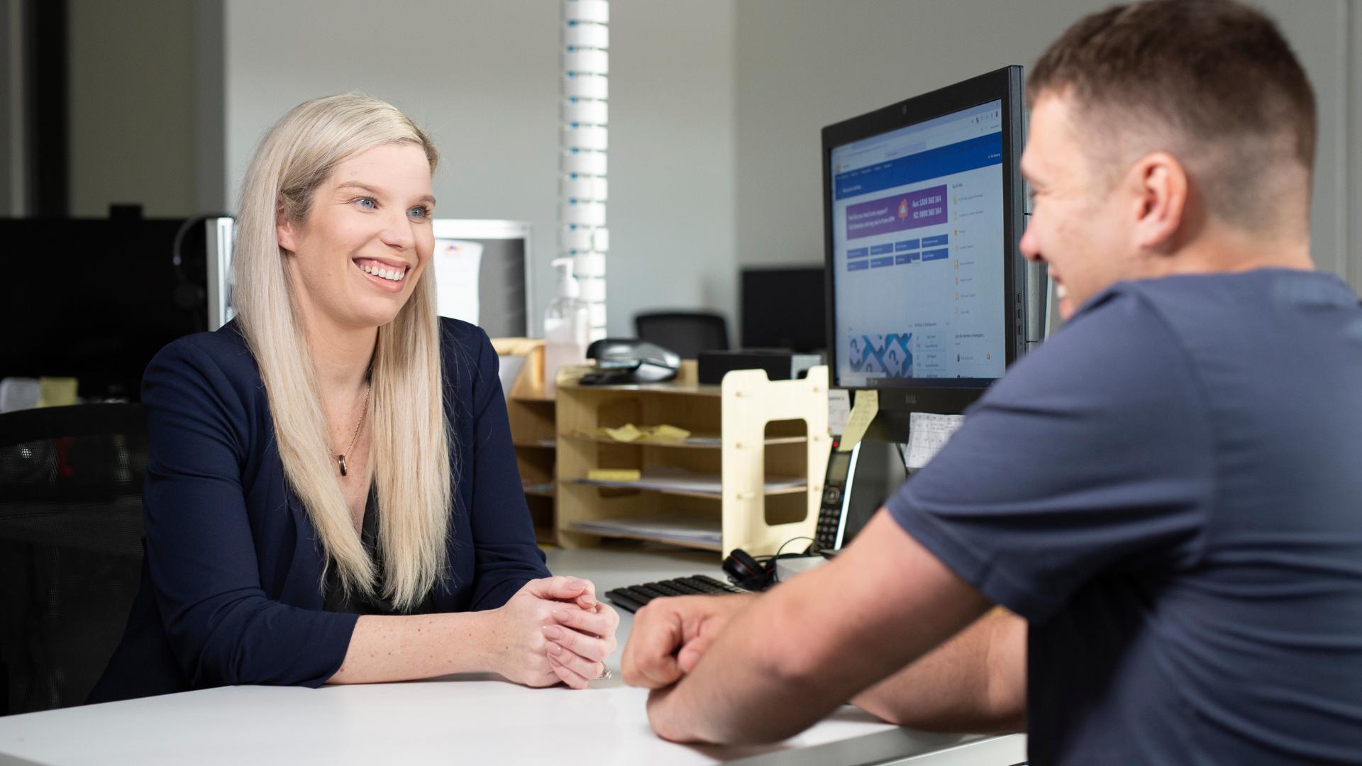 APM EC talking to a DES participant in an APM office