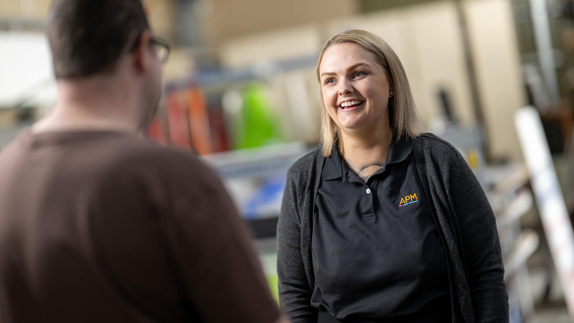 Female DES consultant talking and smiling to a job seeker