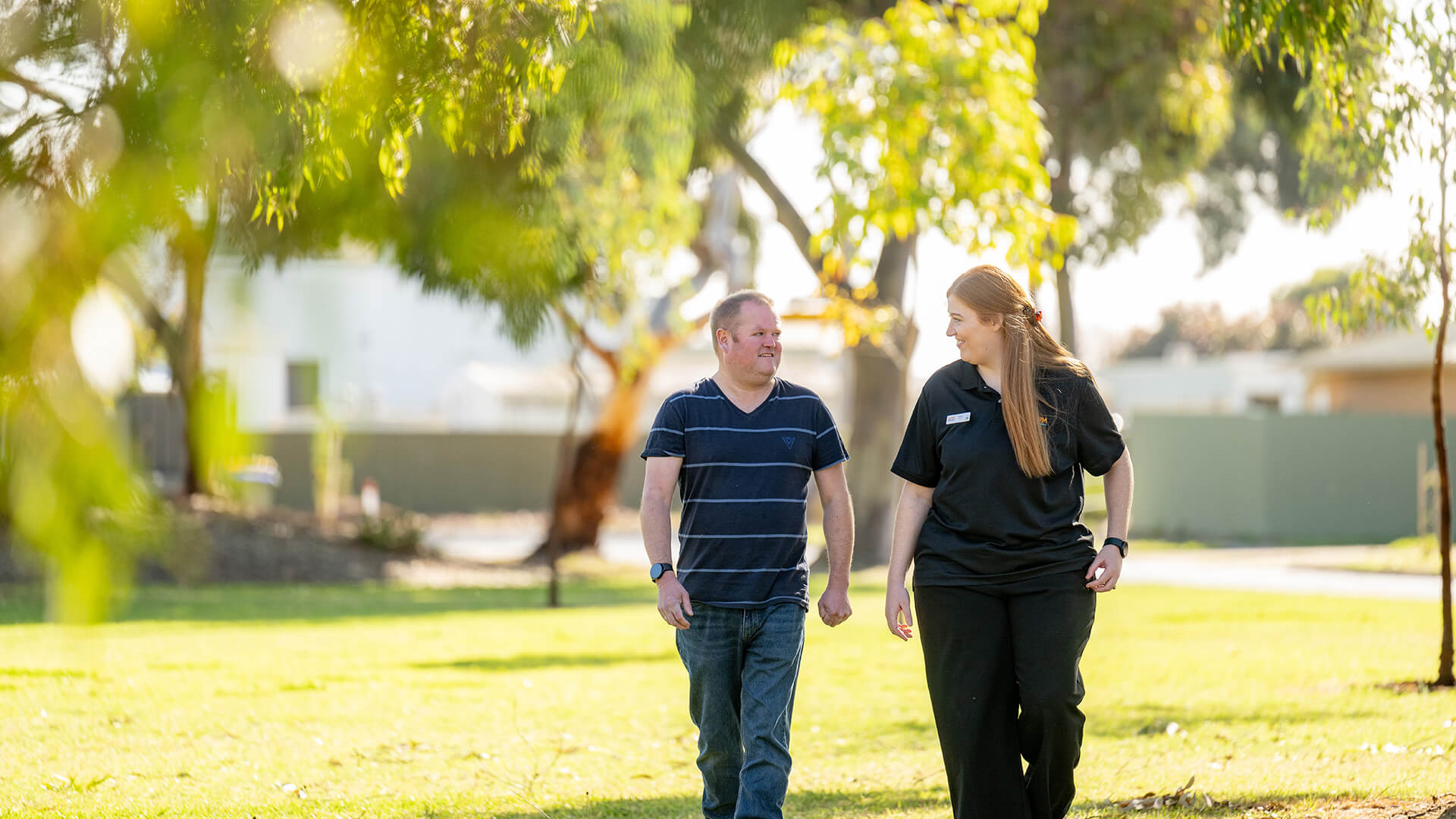 Job seeker with disability walking through portal into new workplace after support from Disabilty Employment Services