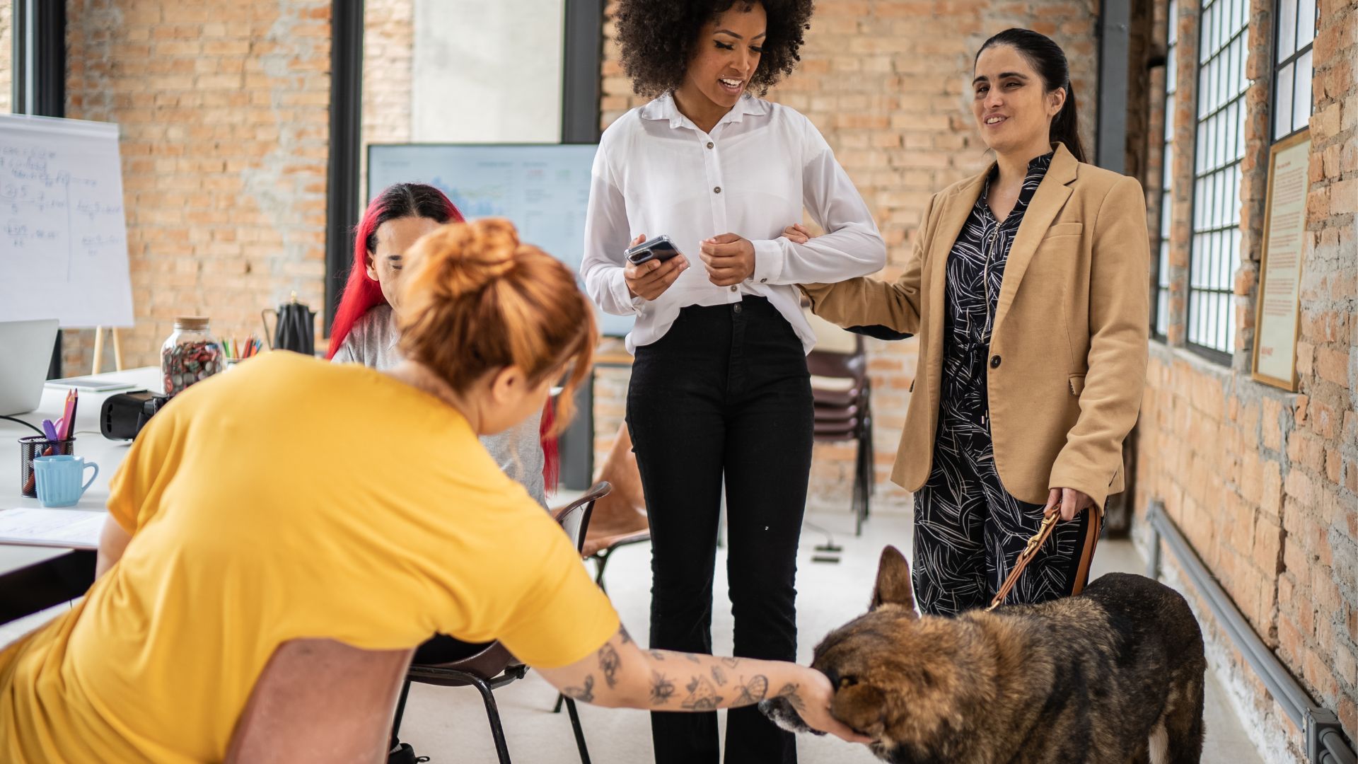 Team meeting focused on accessibility and workplace adjustments, including support for employees with assistive needs.
